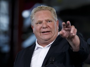 Ontario Premier Doug Ford speaks during an announcement in the the mock-up facility at the Darlington Power Complex, in Bowmanville, Ont., Friday, May 31, 2019. (THE CANADIAN PRESS/Cole Burston)