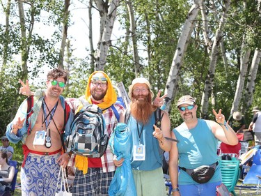 Folk Fest goers Matt Williams, Jeff Debiuk, Mark Kowalski and Josh Etchevery give peace signs while attending the the 46th annual Winnipeg Folk Festival at Birds Hill Provincial Park, north east of Winnipeg, Man., on Saturday, July 13, 2019. The annual Folk Festival runs July 11 to 14, 2019.