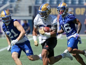 Running back Andrew Harris breaks loose with the ball during Winnipeg Blue Bombers practice on Tuesday, July 23. (Kevin King/Winnipeg Sun)