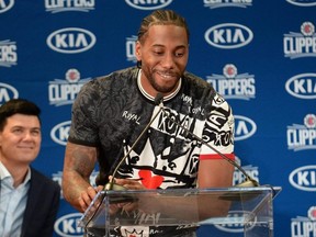 Clippers star Kawhi Leonard smiles at his introductory news conference on Wednesday. USA TODAY