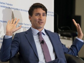 Prime Minister Justin Trudeau gestures as he responds to a question during an arm chair discussion at the Canadian Teachers Federation annual general meeting in Ottawa, Thursday July 11, 2019.