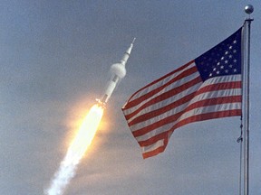 In this July 16, 1969, photo obtained from NASA the Saturn V rocket with the Apollo 11 crew lifts off from the Kennedy Space Center in Florida. (HO/NASA/AFP)