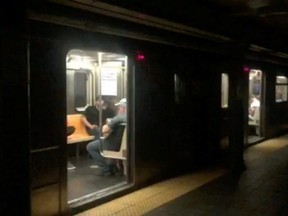 Passengers in a subway train at the 66th Street station during a blackout caused by widespread power outages, in this still frame taken from video, in New York City's Manhattan borough, on Saturday, July 13, 2019.