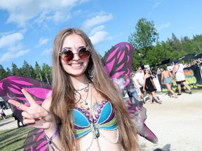 Rina Allan gives peace signs as she attends the 46th annual Winnipeg Folk Festival at Birds Hill Provincial Park, north east of Winnipeg, Man., on Friday, July 7, 2019. This year's Festival runs July 11 to 14, 2019.