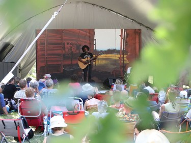 Sunny War is seen performing through leaves from a nearby oak tree on the Little Stage in the Forest on the final day of the 46th annual Winnipeg Folk Festival at Birds Hill Provincial Park, north east of Winnipeg, Man., on Sunday, July 14, 2019.