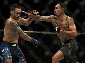 Max Holloway (right) defeated Frankie Edgar (left) in the UFC Featherweight Title Bout at UFC 240 in Edmonton, Canada on Saturday July 27, 2019. (PHOTO BY LARRY WONG/POSTMEDIA)