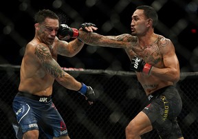 Max Holloway (right) defeated Frankie Edgar (left) in the UFC Featherweight Title Bout at UFC 240 in Edmonton, Canada on Saturday July 27, 2019. (PHOTO BY LARRY WONG/POSTMEDIA)