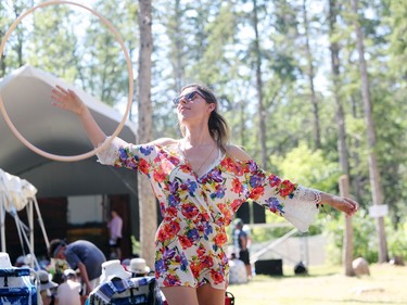 Winnipeg resident Jenna Ferchoff, 25, dances with a hula hoop near the Little Stage in the Forest during the final day of the 46th annual Winnipeg Folk Festival at Birds Hill Provincial Park, north east of Winnipeg, Man., on Sunday, July 14, 2019.