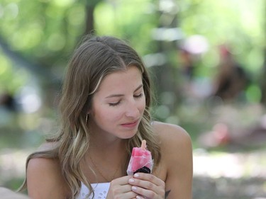 Winnipegger Haley Pedreira enjoys a popsicle as she attends the 46th annual Winnipeg Folk Festival at Birds Hill Provincial Park, north east of Winnipeg, Man., on Friday, July 12, 2019. This year's Folk Festival runs July 11 to 14, 2019.