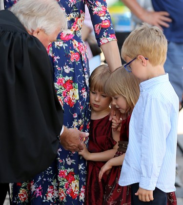 Twins Amelia and Alyssa Koval, 3, meet former chief of protocol Dwight MacAulay, who presided over a special citizenship ceremony at Assiniboine Park in Winnipeg on Mon., July 1, 2019. Kevin King/Winnipeg Sun/Postmedia Network