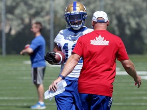 Nic Demski listens to offensive co-ordinator Paul LaPolice during Winnipeg Blue Bombers practice on the University of Manitoba campus on Monday.