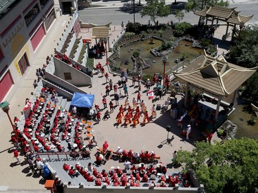 An overhead view from a nearby balcony of a Guinness World Record attempt for largest group drum roll (multiple venues) at the Chinatown Gardens on King Street in Winnipeg on Mon., July 1, 2019. Winnipeg was one of 11 communities coming together to vie for the record. Kevin King/Winnipeg Sun/Postmedia Network