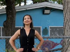 Marli Sakiyama, founder of the River Heights Crescentwood Safety Association, poses for a photograph at Harrow Park, where it worked with the city to have new lighting installed, on Tuesday. The association is working to have motion detector lights installed for free in the lanes and yards of strategic properties.