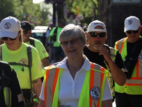Canadian Senator Patricia Bovey joins the West Broadway Bear Clan Patrol on a walk through the Winnipeg community on Friday.