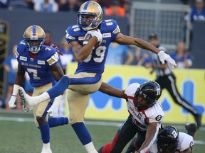 CFL Winnipeg Blue Bombers #89 Kenny Lawler breaks tackles from Ottawa Red Blacks players, on his way to score, in game action, in Winnipeg on Friday, July 19, 2019. 
Chris Procaylo/Winnipeg Sun file