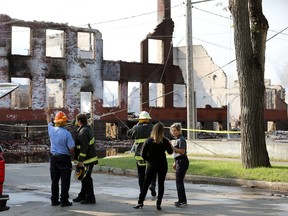 Winnipeg Fire Paramedic Service personnel discuss a warehouse fire on Jarvis Avenue on Mon., July 22, 2019. Kevin King/Winnipeg Sun/Postmedia Network