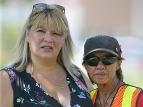 Bernadette Smith (left), MLA for Point Douglas with Brenda Osborne who is the mother of Claudette Osborne-Tyo, who went missing eleven years ago at the No Stone Unturned concert in Winnipeg on Saturday, July 27, 2019. Osborne is the mother of Claudette Osborne-Tyo, who went missing eleven years ago in Winnipeg. Winnipeg Sun/Chris Procaylo/stf