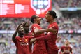 Liverpool defender Virgil Van Dijk (right) looks to lead his club to its first Premier League title. (GETTY IMAGES)