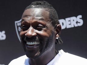 Oakland Raiders wide receiver Antonio Brown speaks to reporters after NFL football practice at the team's headquarters in Alameda, Calif., Tuesday, May 28, 2019.