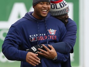 Reggie Abercrombie (right) hugs Willy Garcia during Goldeyes spring training at Shaw Park in May. Garcia is hitting .360 
with 29 runs scored, 13 doubles, eight home runs and 39 RBIs in 34 American Association games. (KEVIN KING/WINNIPEG SUN FILES)