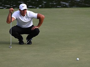 Aug 23, 2019; Atlanta, GA, USA; Brooks Koepka lines up a putt on the 15th hole during the second round of the Tour Championship golf tournament at East Lake Golf Club. Mandatory Credit: Adam Hagy-USA TODAY Sports