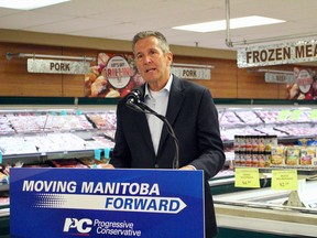 Manitoba Progressive Conservative leader Brian Pallister promises to repeal a piece of legislation that restricts shopping hours on Sundays and holidays at a press conference in Winnipeg on Friday.