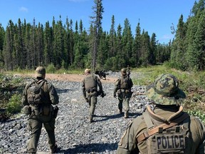 RCMP search an area near Gillam, Man. in this photo posted to their Twitter page on Tuesday, July 30.