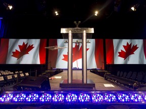 A podium sits empty at the Telus Convention Centre in Calgary, Alta., on Oct. 19, 2015. (Lyle Aspinall/Calgary Sun/Postmedia Network)