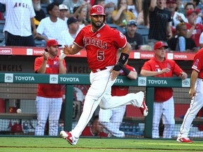 Los Angeles Angels first baseman Albert Pujols scores a run on a double by third baseman David Fletcher (6) in the fourth inning of the game against the Pittsburgh Pirates at Angel Stadium of Anaheim.