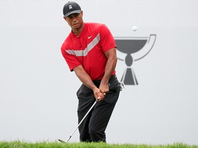 Tiger Woods plays his third shot on the 18th hole during the final round of the BMW Championship at Medinah Country Club No. 3 on August 18, 2019 in Medinah, Illinois. (Cliff Hawkins/Getty Images)