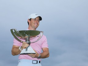 ATLANTA, GEORGIA - AUGUST 25: Rory McIlroy of Northern Ireland celebrates with the FedExCup trophy after winning during the final round of the TOUR Championship at East Lake Golf Club on August 25, 2019 in Atlanta, Georgia.
