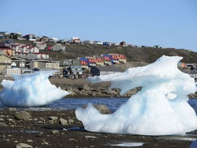 Sea ice melts in Frobisher Bay, Iqaluit, Nunavut on Wednesday, July 31, 2019. Prime Minister Justin Trudeau is in Canada's Far North to witness some of the more dramatic effects of climate change, part of an effort highlight his Liberal government's record on climate action ahead of the federal election.