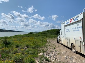 Manitoba RCMP's Underwater Recovery Team (URT) is seen in this police image published to social media on Sunday, August 4, 2019. RCMP announced that on Friday afternoon, Manitoba RCMP officers searching from a helicopter, located a damaged aluminum boat on the shore of the Nelson River which is northeast of Gillam, Man. RCMP Underwater Recovery Team (URT) will conduct a thorough underwater search of significant areas of interest Sunday, August 4.