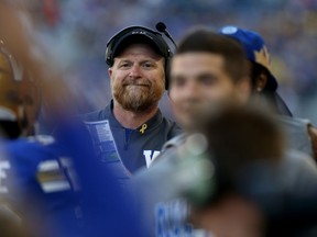 Winnipeg Blue Bombers head coach Mike O'Shea waits to congratulate kick returner Janarion Grant on his punt return touchdown against the Calgary Stampeders during CFL action in Winnipeg on Thurs., Aug. 8, 2019. Kevin King/Winnipeg Sun/Postmedia Network