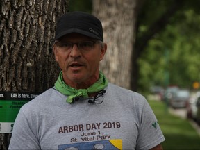 Gerry Engel, arborist and board chair of Trees Winnipeg, warns residents of the impacts of the invasive emerald ash borer insect during the launch of Emerald Ash Borer Preparedness Week in Winnipeg on Monday.
