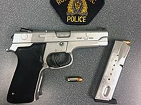A file photo of a Smith and Wesson RCMP service pistol similar to a Smith and Wesson 5906 handgun that police said was stolen during a home break-in in Winnipeg on Thursday or Friday. A Taser along with numerous personal items were also stolen during the break and enter, Winnipeg Police said.