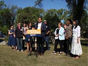 NDP Leader Wab Kinew (centre), along with candidates and local residents, promises to address the addictions crises in Winnipeg, during an announcement at Vimy Ridge Park on Monday, Aug. 19, 2019. DANTON UNGER/Winnipeg Sun/Postmedia Network