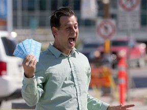 James Beddome, leader of Manitoba's Green Party handed out bus tokens while on the campaign trail on Friday.