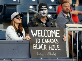Oakland Raiders fans have fun with their sign during NFL exhibition action against the Green Bay Packers at IG Field in Winnipeg on Thurs., Aug. 22, 2019. Kevin King/Winnipeg Sun/Postmedia Network