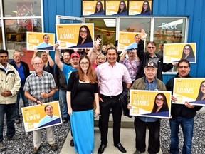 Manitoba NDP Leader Wab Kinew (centre) campaigns in the northern Manitoba community of Thompson with Danielle Adams, the NDP candidate for Thompson, on Saturday.