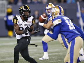 Hamilton Tiger-Cats' Bralon Addison catches a pass against the Winnipeg Blue Bombers during Friday's game. (THE CANADIAN PRESS)