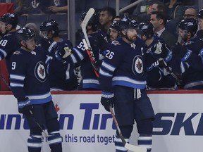 Winnipeg Jets right wing Blake Wheeler (26) celebrates his first period goal against the Minnesota Wild at Bell MTS Place on Wednesday.