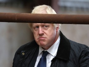 Britain's Prime Minister Boris Johnson gestures during a visit to Darnford Farm in Banchory near Aberdeen in Scotland on Sept. 6, 2019. (ANDREW MILLIGAN/AFP/Getty Images)