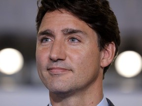 In this file photo taken on August 26, 2019 Canada's Prime Minister Justin Trudeau addresses media representatives at a press conference in Biarritz, south-west France, on the third day of the annual G7 Summit attended by the leaders of the world's seven richest democracies, Britain, Canada, France, Germany, Italy, Japan and the United States.
