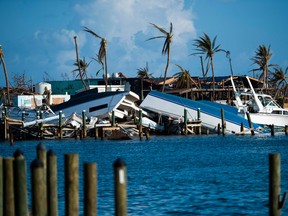 Destroyed boats are pushed up against the pier in the aftermath of Hurricane Dorian in Treasure Cay on Abaco island, Bahamas, on September 11, 2019. (Photo by Andrew CABALLERO-REYNOLDS / AFP)