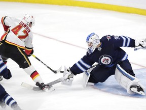 Winnipeg Jets goaltender Laurent Brossoit stopped 22 of 23 shots against Calgary Sunday. (USA Today)
