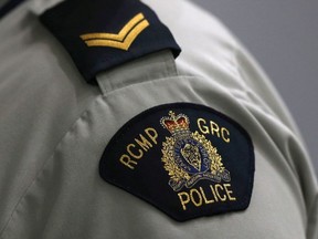 A Royal Canadian Mounted Police crest is seen on a member's uniform.