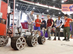 New research suggests that the trust Canadians place in science may be eroding. Students check out a robotic rover at the Canada-Wide Science Fair at Carleton University, in Ottawa on Wednesday, May 16, 2018.