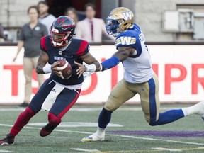 Montreal Alouettes quarterback Vernon Adams Jr., left, breaks away from Winnipeg Blue Bombers defensive lineman Willie Jefferson during second half CFL football action in Montreal, Saturday, September 21, 2019.