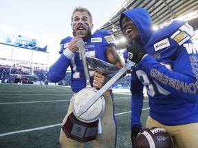 CP-Web.  Winnipeg Blue Bombers quarterback Chris Streveler (17) and Winston Rose (30) celebrate winning the Banjo Bowl after defeating the Saskatchewan Roughriders in CFL action in Winnipeg Saturday, September 7, 2019. THE CANADIAN PRESS/John Woods ORG XMIT: JGW122